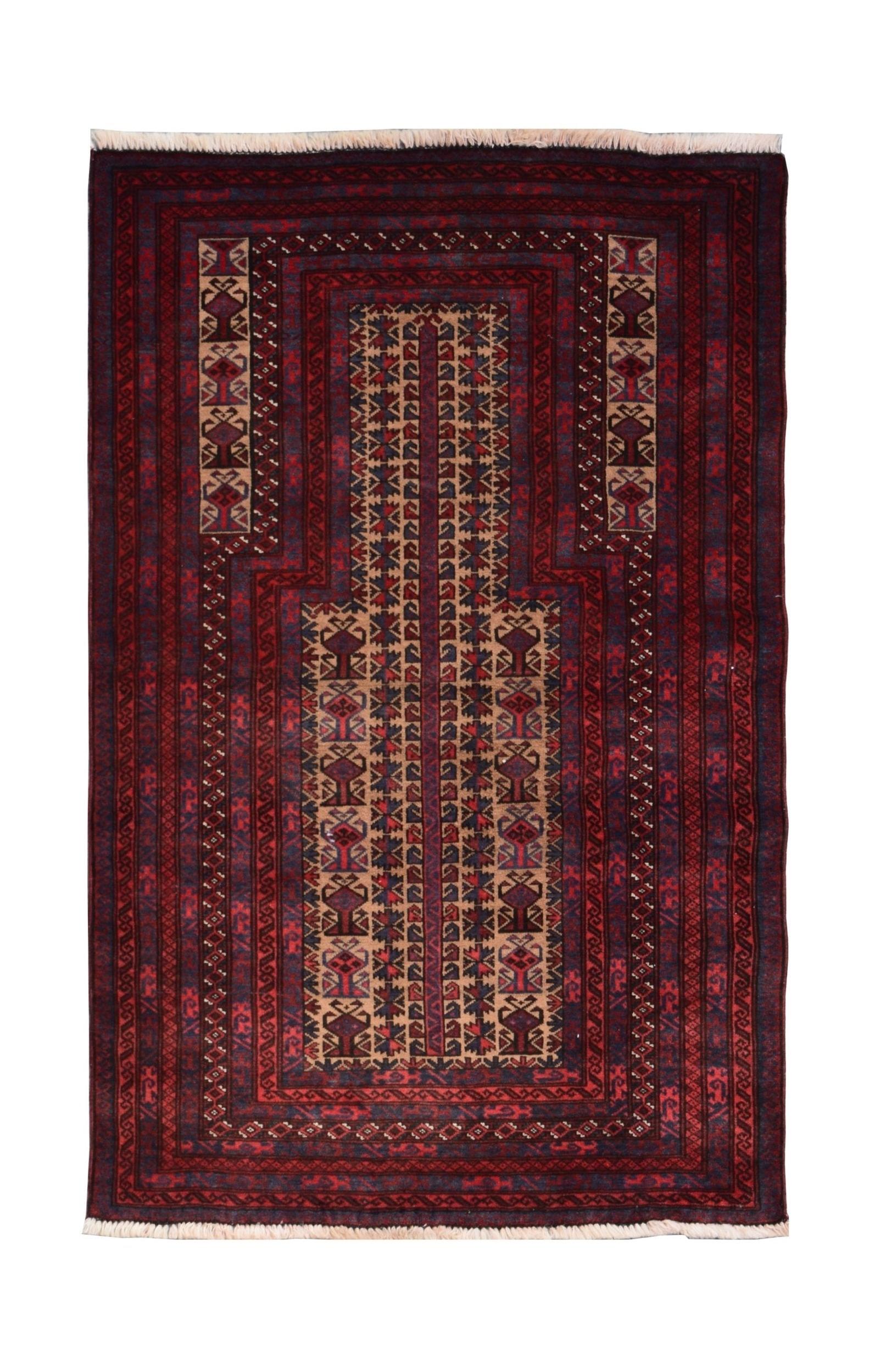 A handmade vintage Afghan Baluch rug featuring a traditional prayer design in deep red and blue.