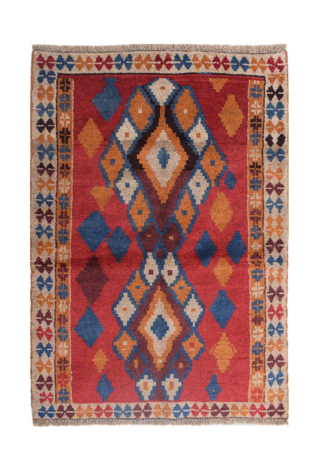 Handmade Afghan Pashm rug featuring a geometric diamond pattern in red, blue, and orange tones.
