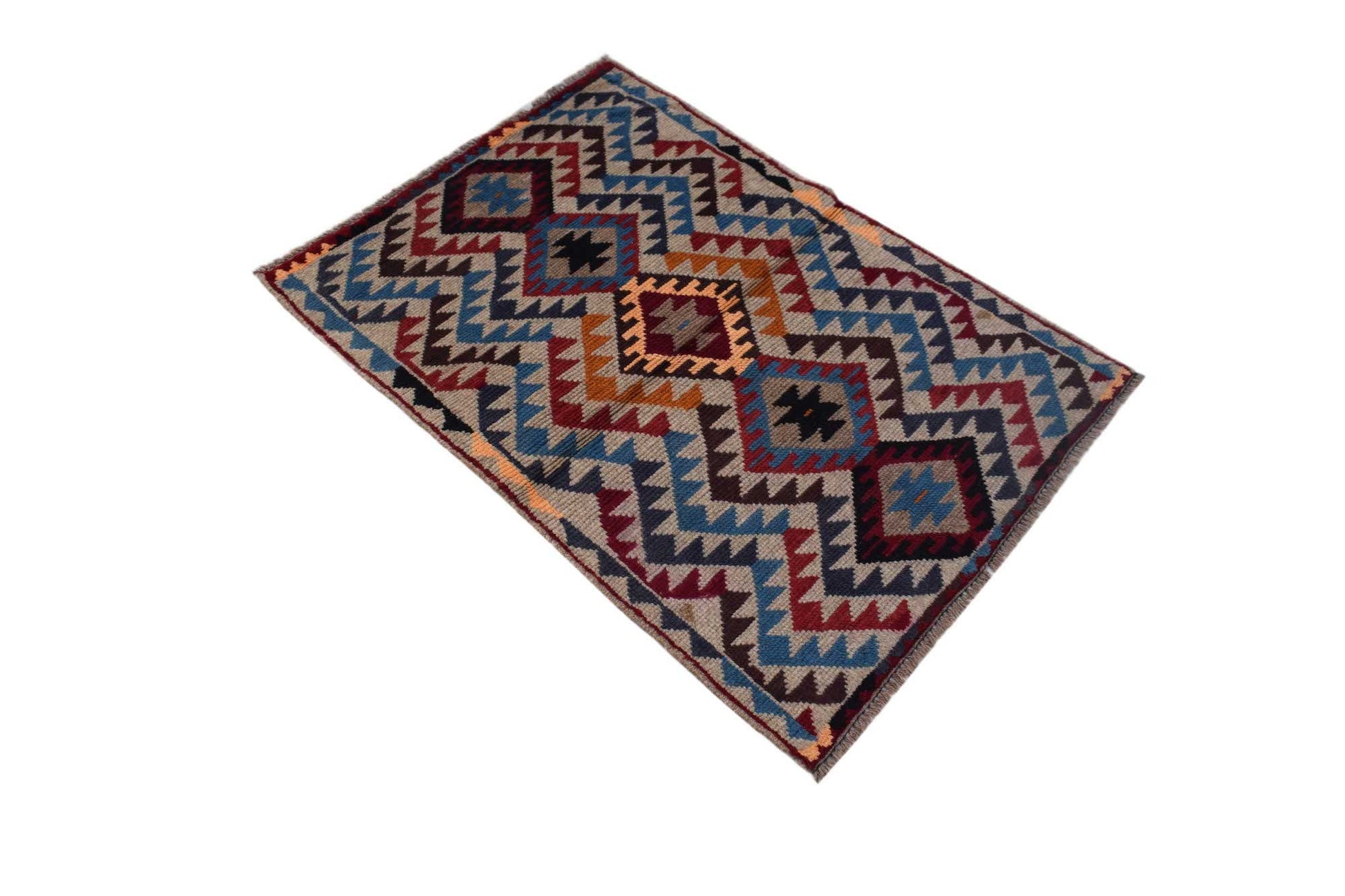 Handmade Afghan Pashm rug featuring a geometric tribal pattern in shades of red, blue, and brown.