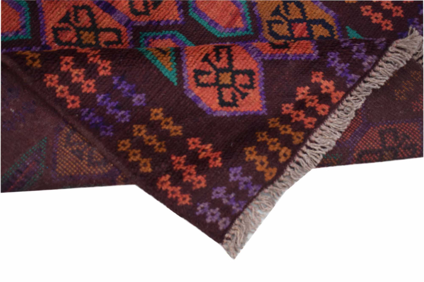 A handmade Afghan Pashm rug featuring geometric patterns in dark brown, orange, and purple.