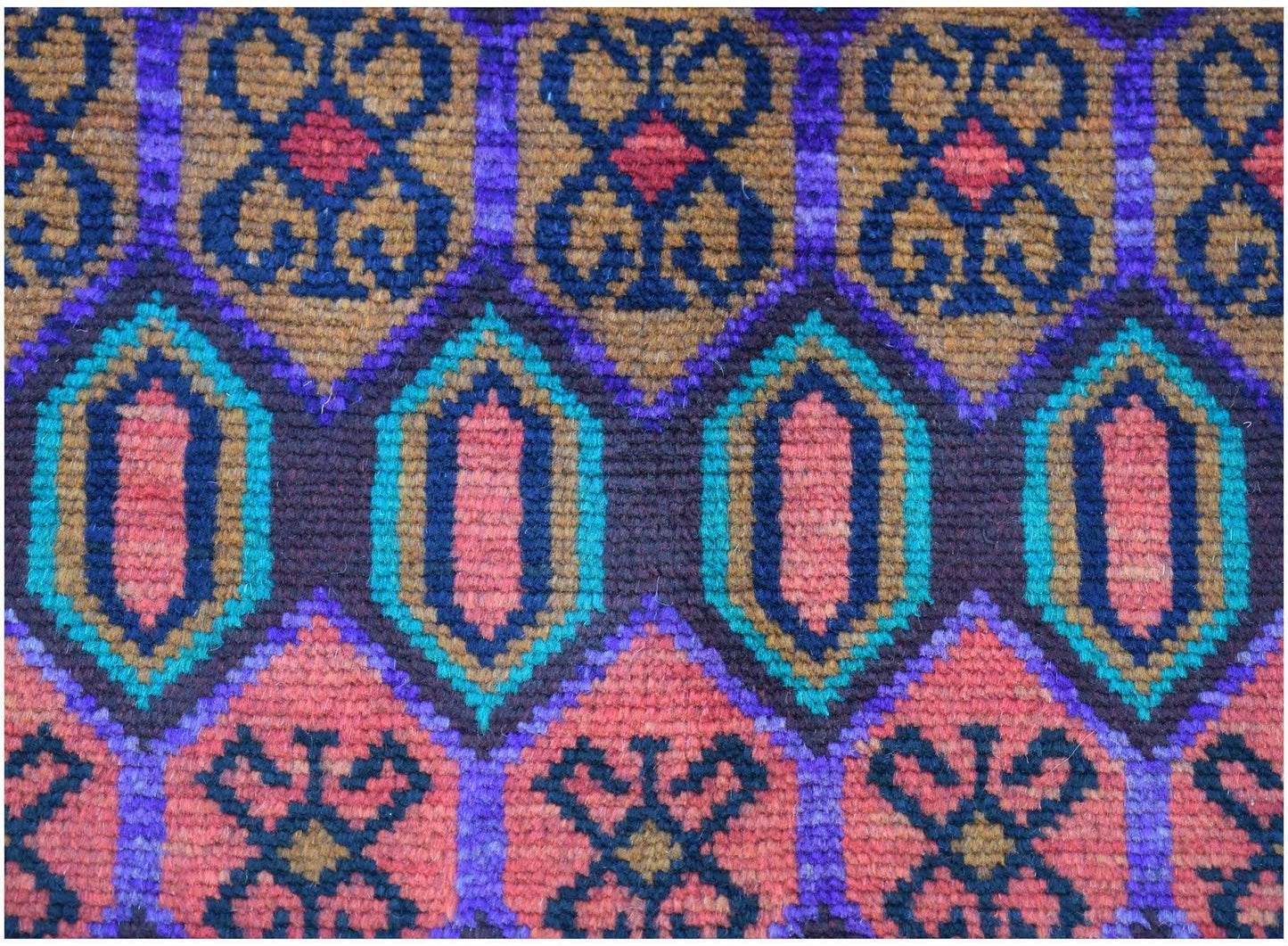 Handmade Afghan Pashm rug featuring a geometric pattern in shades of red, blue, and brown.