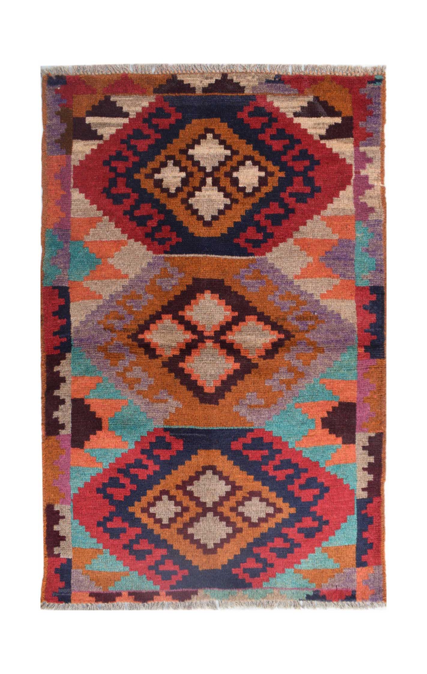 Handmade Afghan Pashm rug featuring a geometric tribal pattern in red, blue, and orange tones.