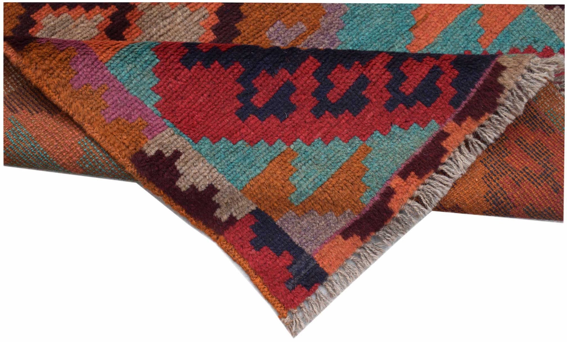 A handmade Afghan Pashm rug featuring a geometric tribal pattern in red, blue, and brown tones.