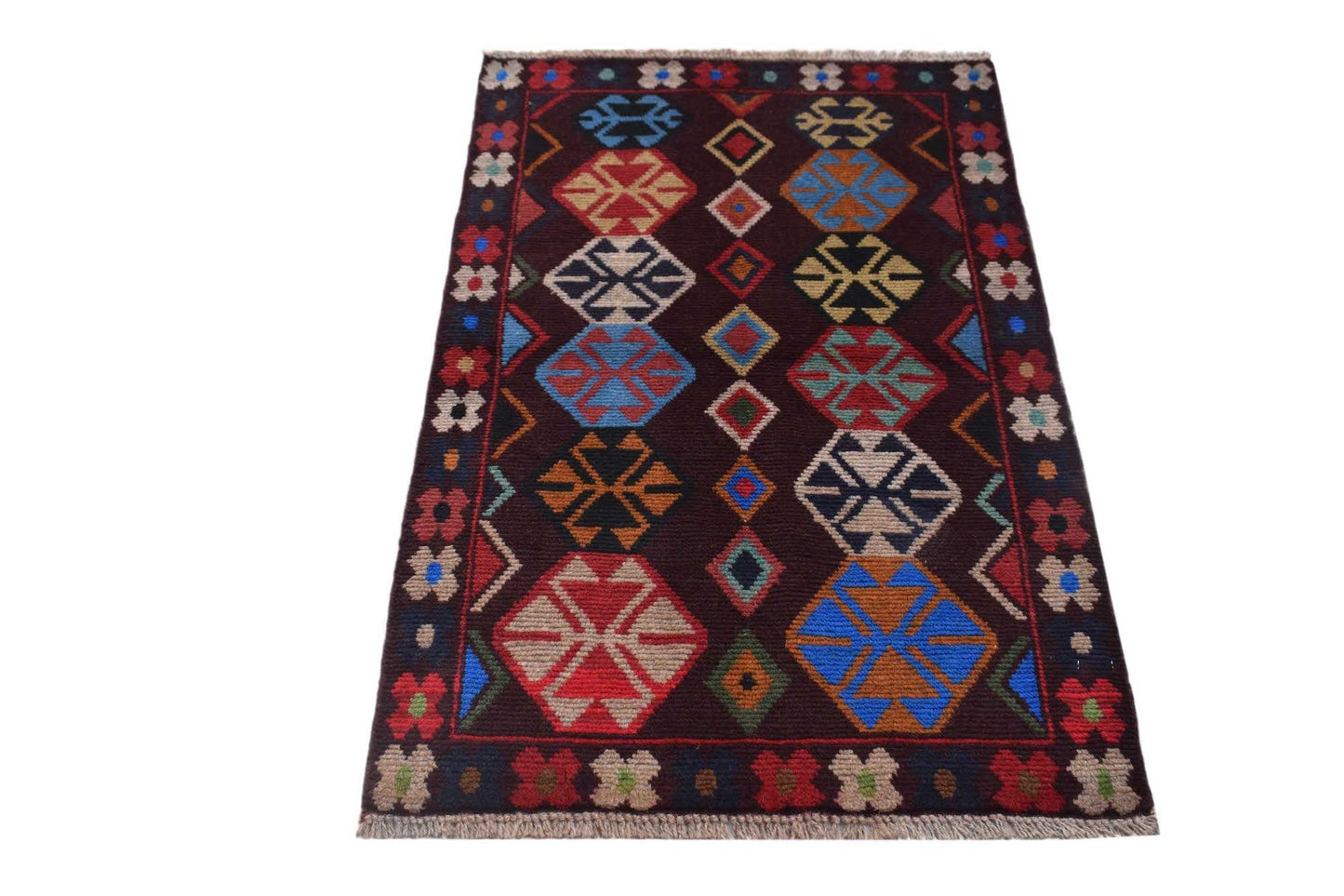 Handmade Afghan Pashm rug featuring geometric tribal patterns in dark red, blue, and brown tones.