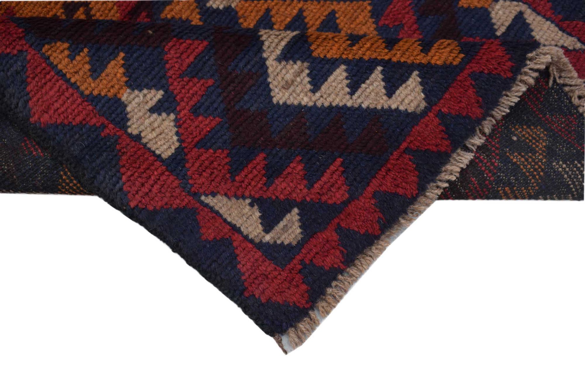 A handmade Afghan Pashm rug featuring a geometric tribal pattern in dark red, blue, and tan wool.