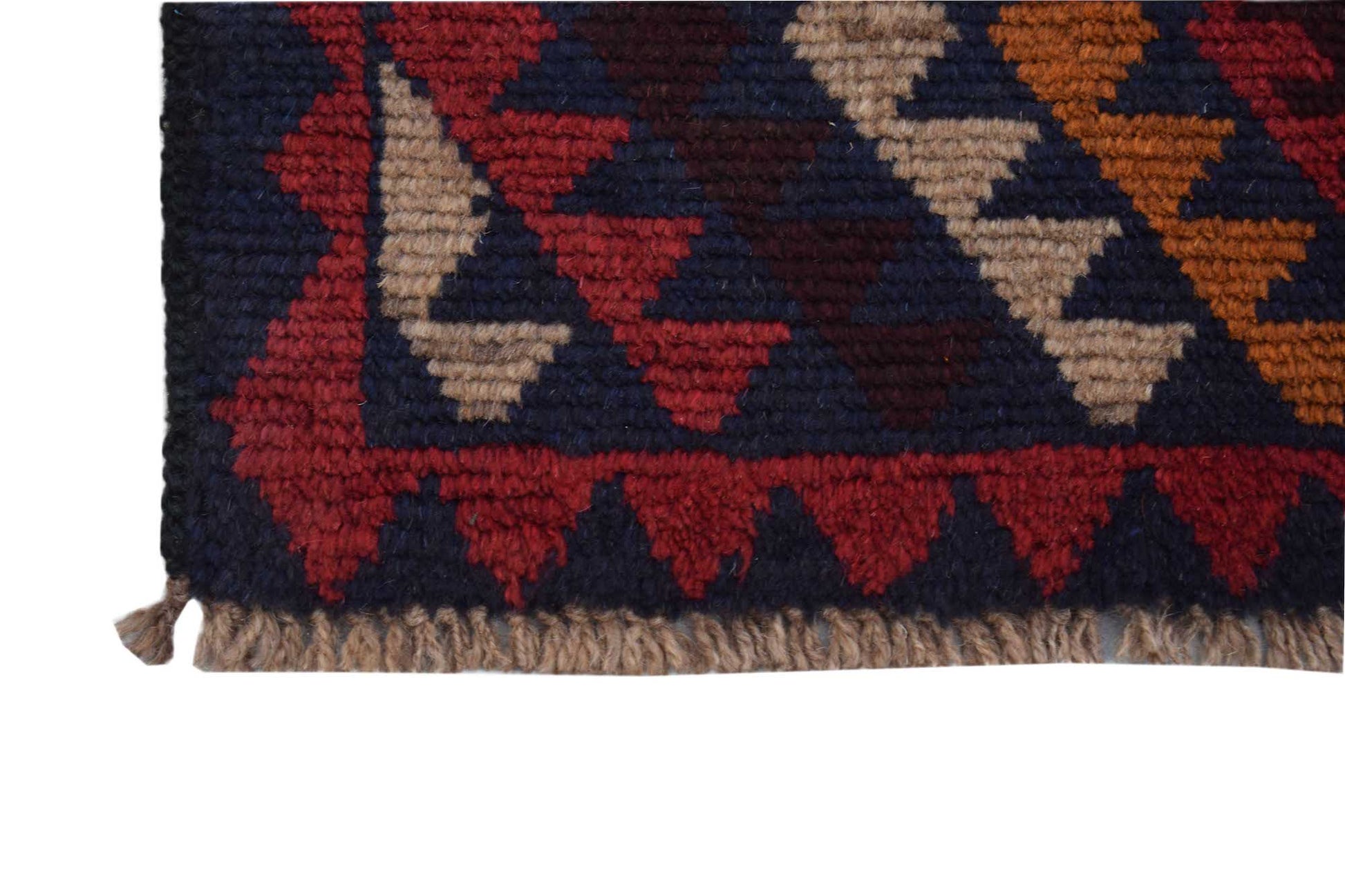 A handmade Afghan Pashm rug featuring a geometric pattern in dark red, blue, and tan wool.