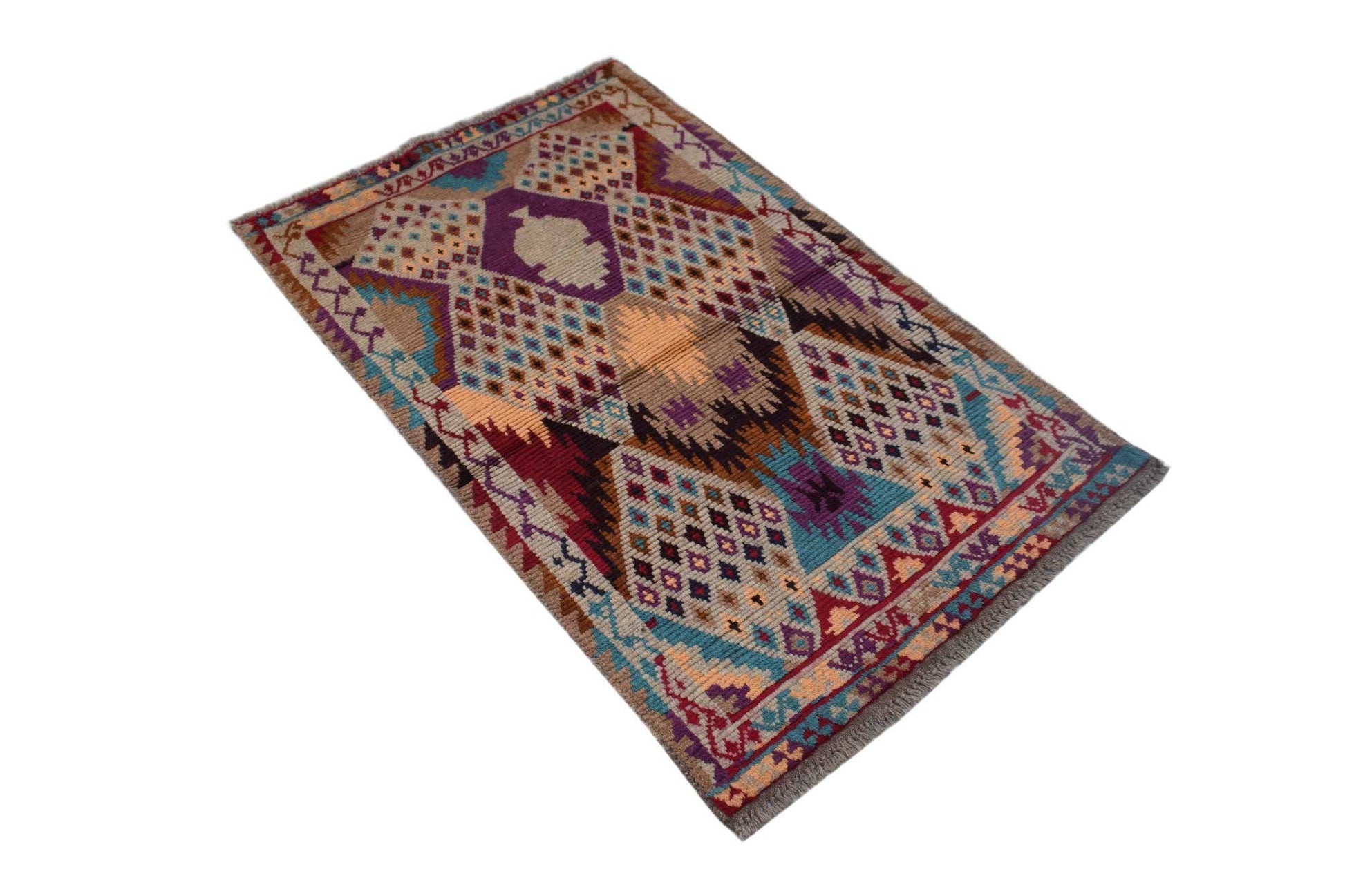 A handmade Afghan Pashm rug featuring a geometric tribal pattern in shades of red, blue, and brown.