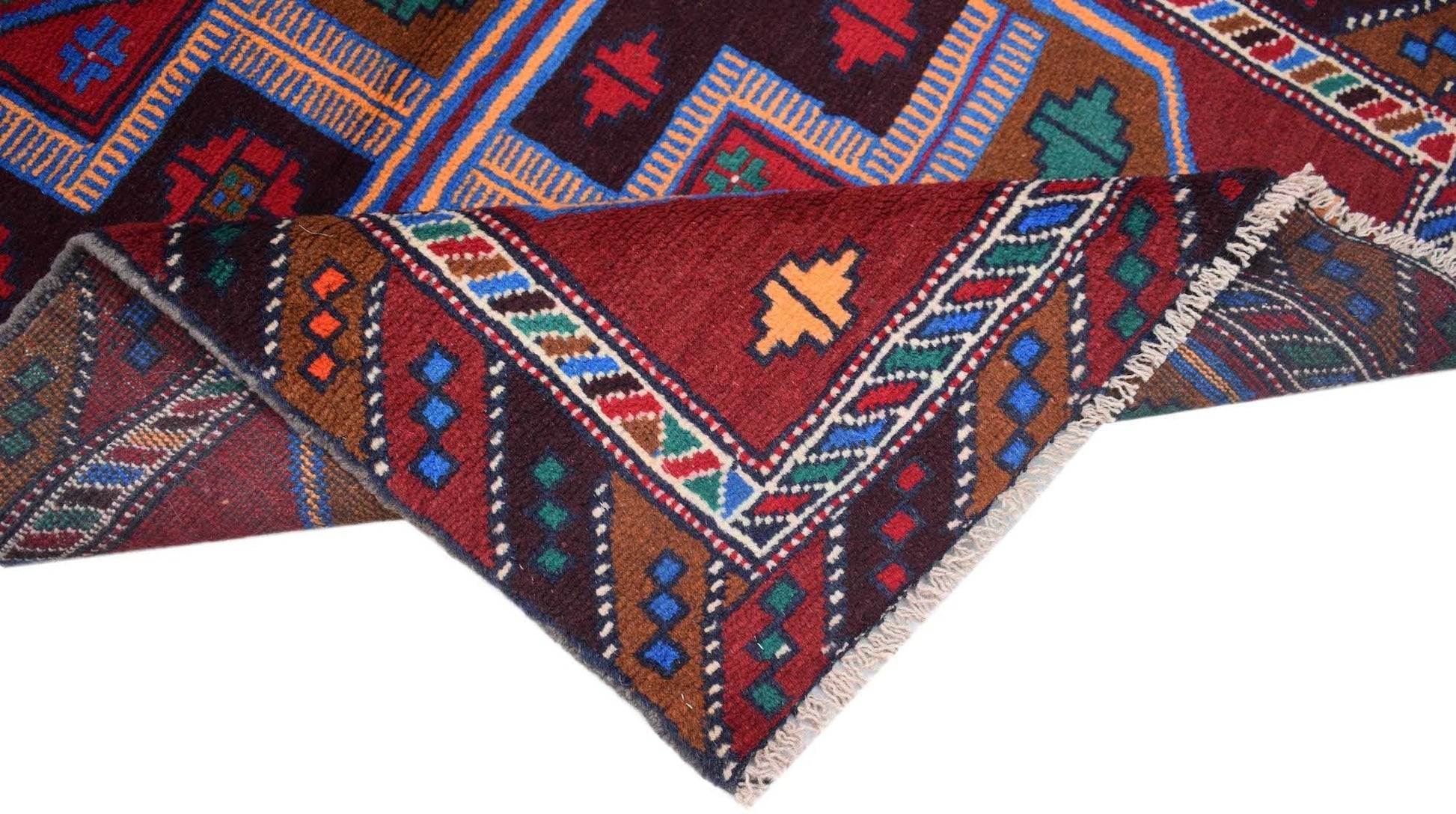 A handmade Afghan Pashm rug featuring traditional geometric patterns in deep red, blue, and brown.
