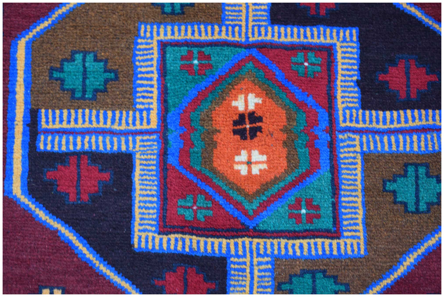 Handmade Afghan Pashm rug featuring a geometric tribal pattern in red, blue, brown, and ivory.