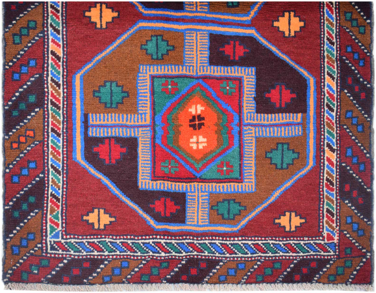 Handmade Afghan Pashm rug featuring a geometric tribal pattern in red, brown, and blue wool.