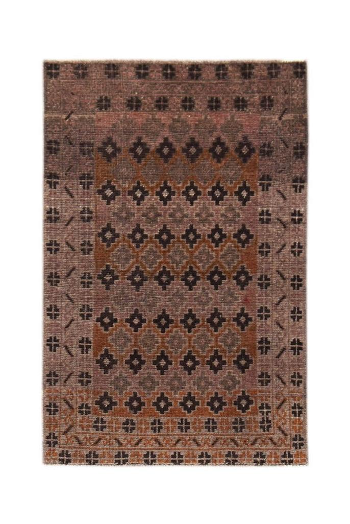A rectangular vintage Afghan Baluch rug featuring a geometric pattern in brown and rust tones.