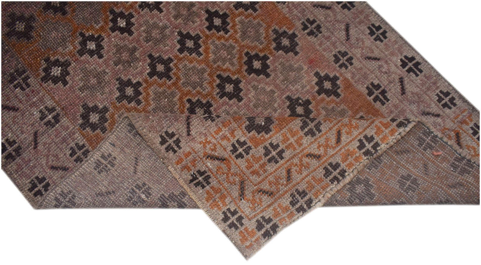 A vintage Afghan Baluch rug featuring a geometric pattern in shades of brown and rust.