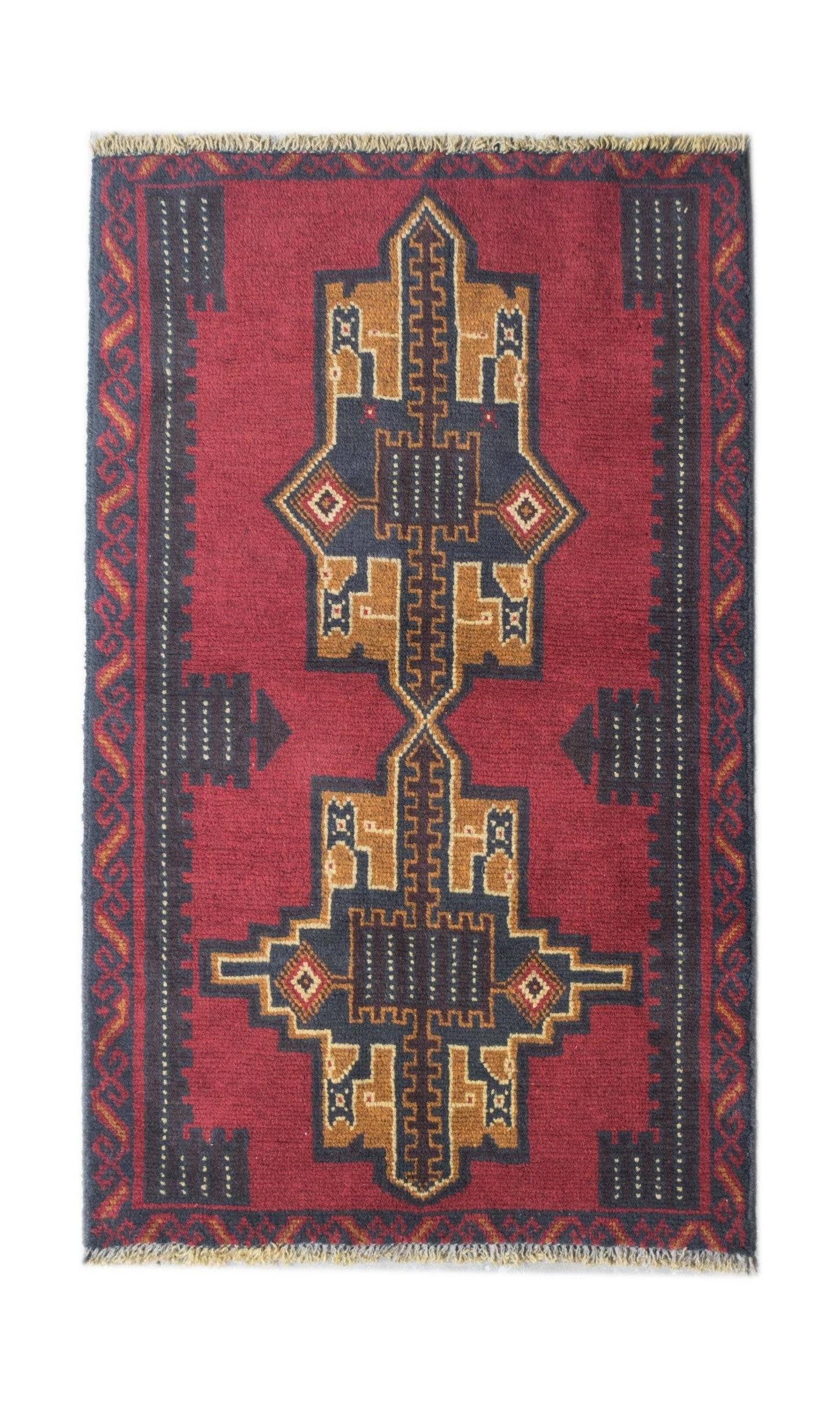 Handmade Afghan Pashm rug featuring a geometric tribal pattern in deep red, brown, and blue.