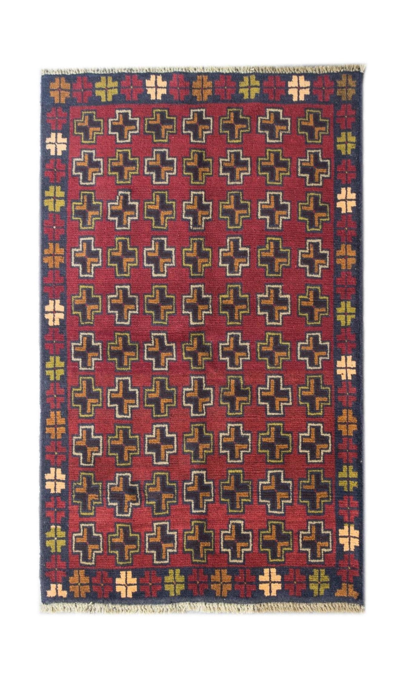 Handmade Afghan Pashm rug featuring a repeating cross pattern in red, brown, and blue tones.