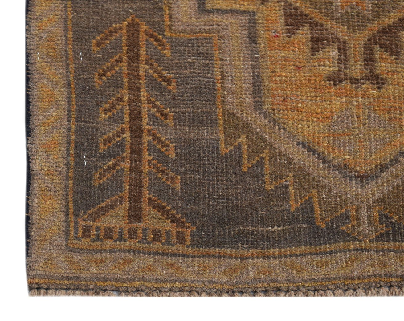 A handmade Afghan Baluch rug featuring a dark brown field with a stylized tree and geometric border.