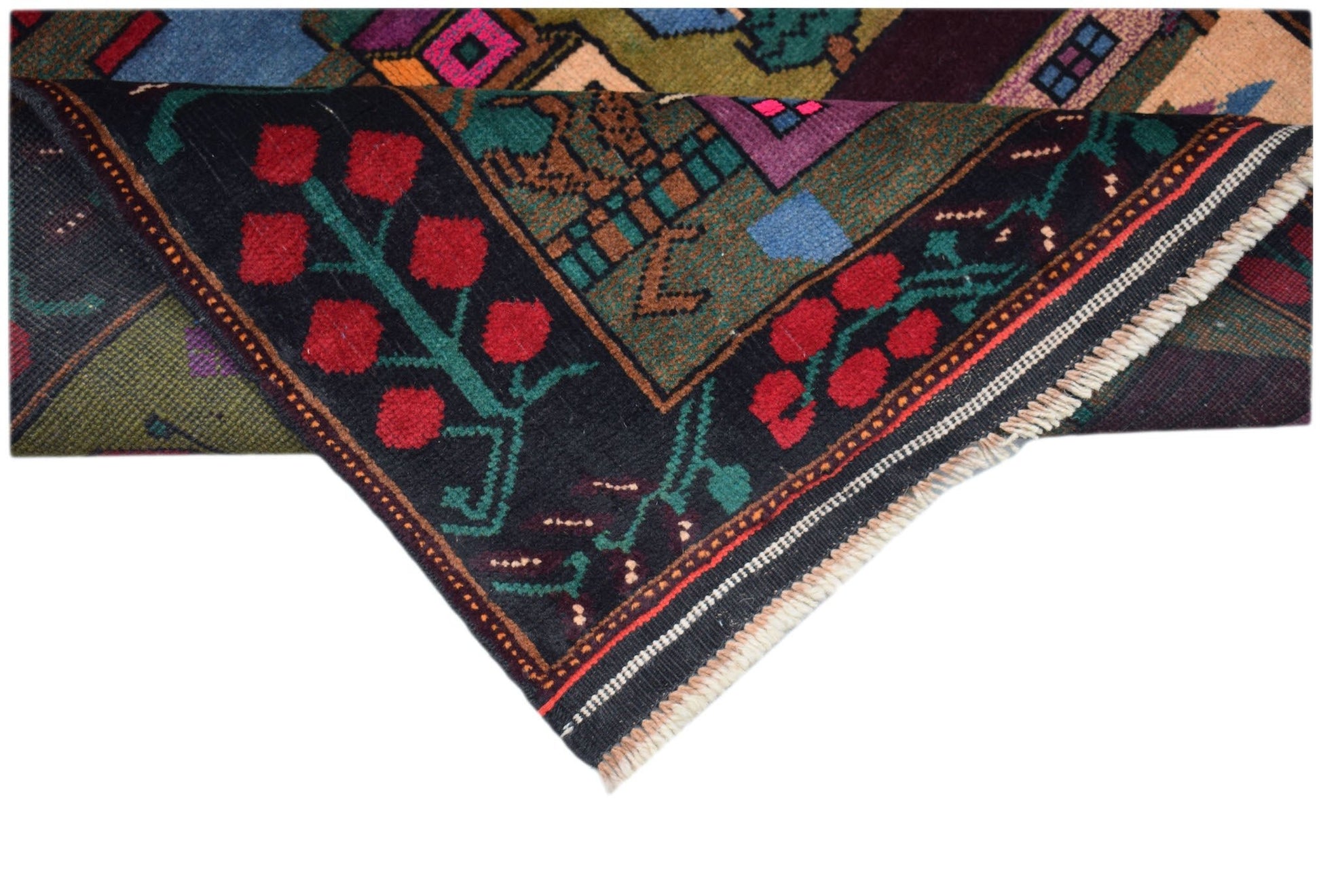 A handmade Afghan Baluch rug featuring a dark field with red floral motifs and a fringed edge.