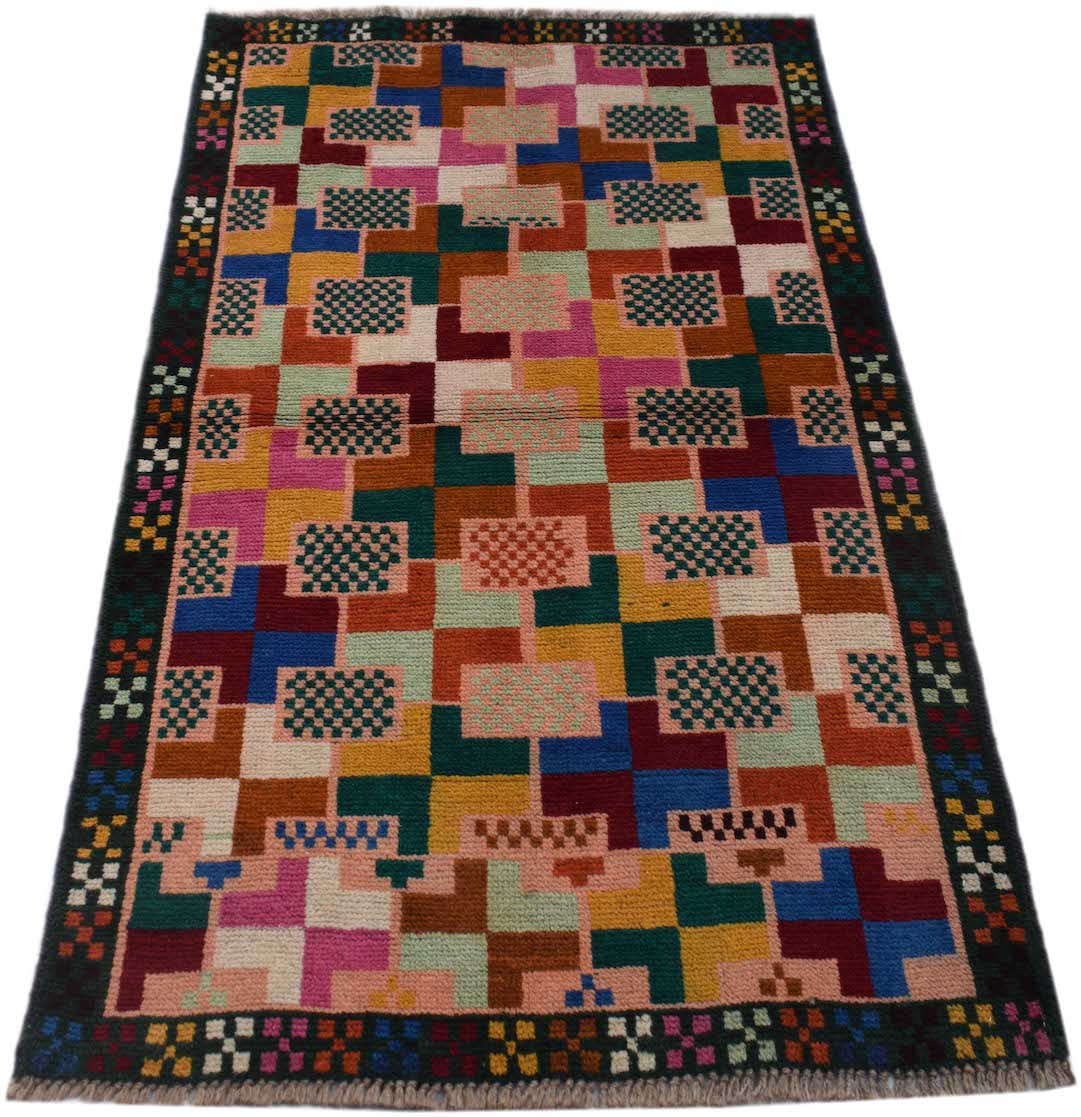 Handmade Afghan Pashm rug featuring a colorful geometric block pattern and a dark border.
