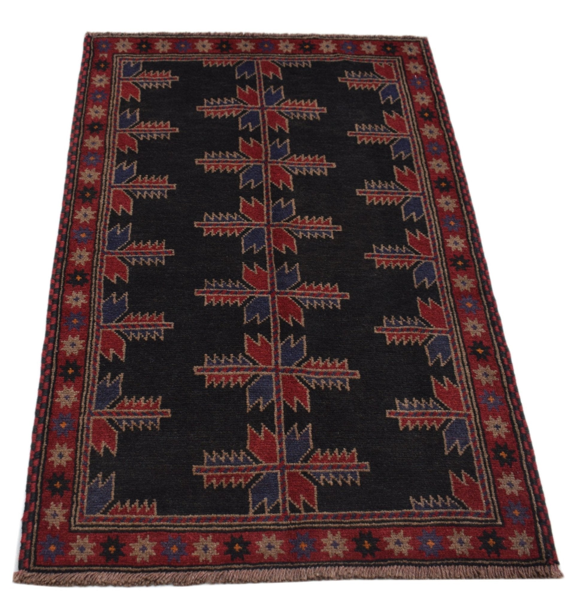 Handmade Afghan Baluch rug featuring a dark field with repeating geometric floral motifs.