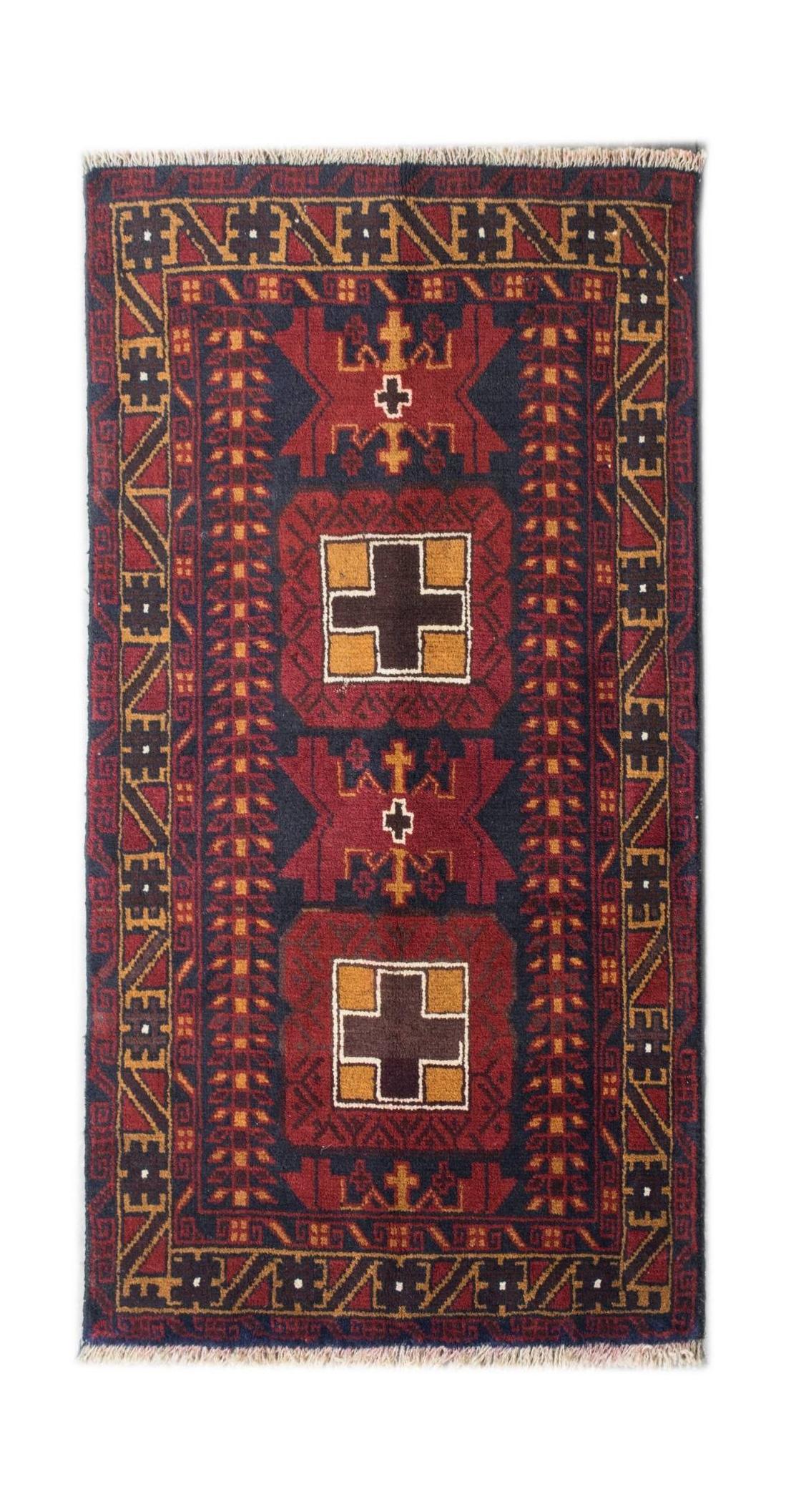 A handmade vintage Afghan Baluch rug featuring geometric cross motifs in red, brown, and blue.
