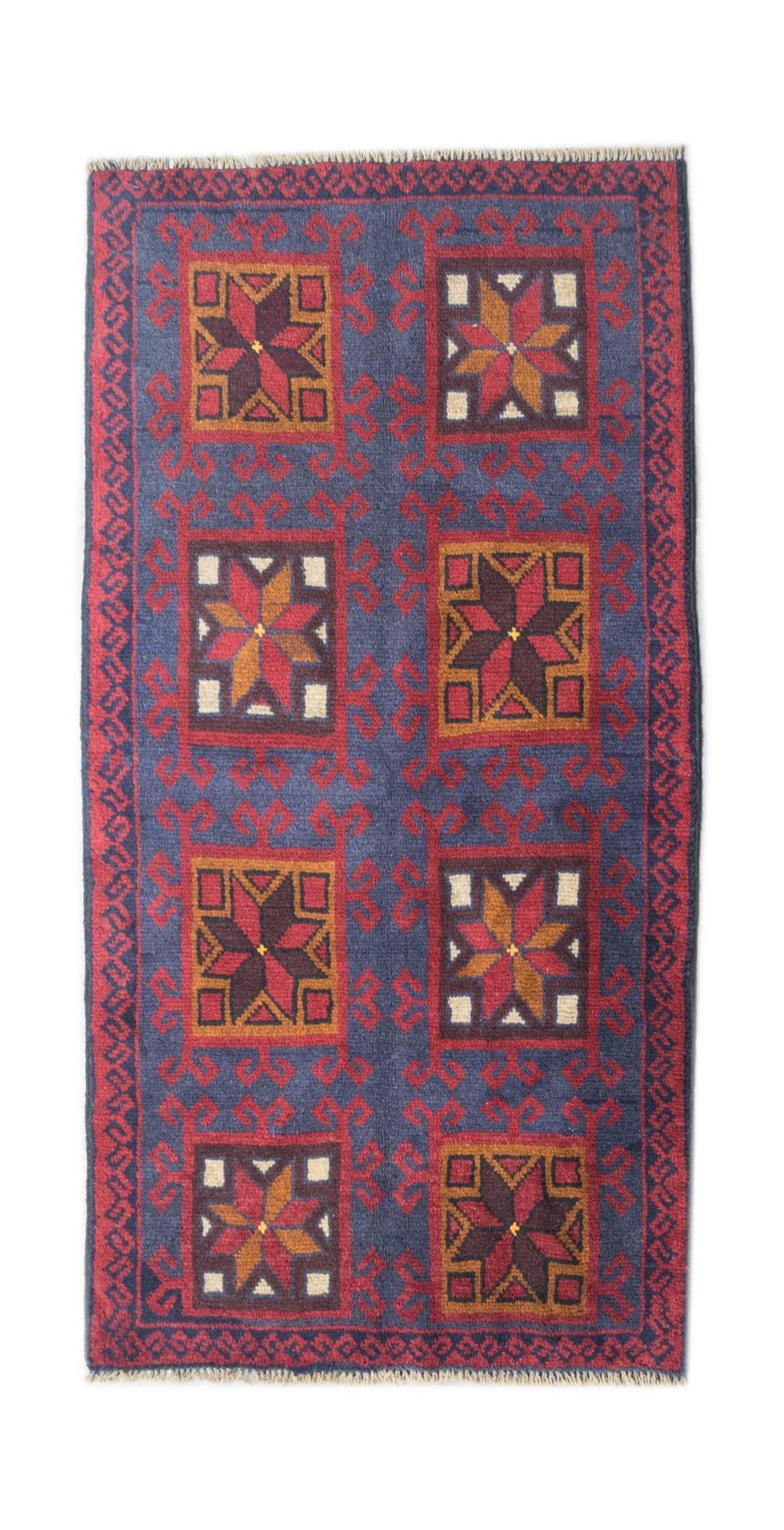 Handmade Afghan Pashm rug featuring geometric star motifs in red, blue, and ivory wool.