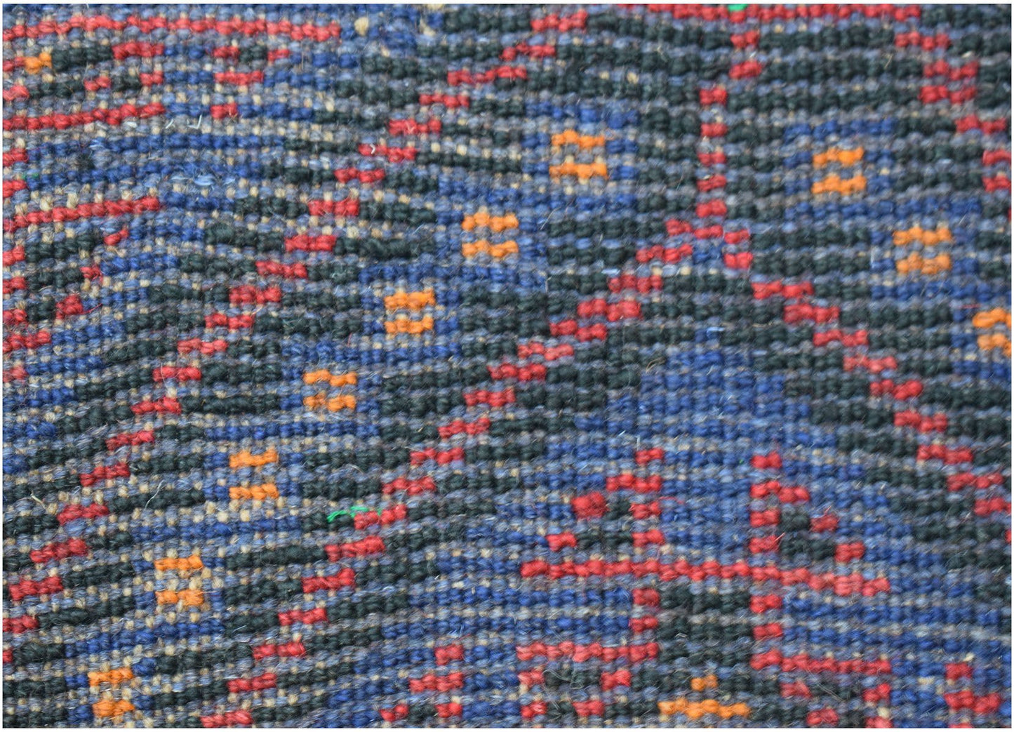 Handmade Afghan Baluch rug featuring a geometric pattern in dark blue, red, and orange wool.