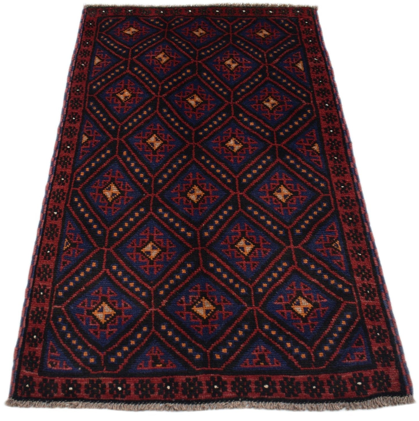 Handmade Afghan Baluch rug featuring a dark blue and red diamond pattern with ivory accents.