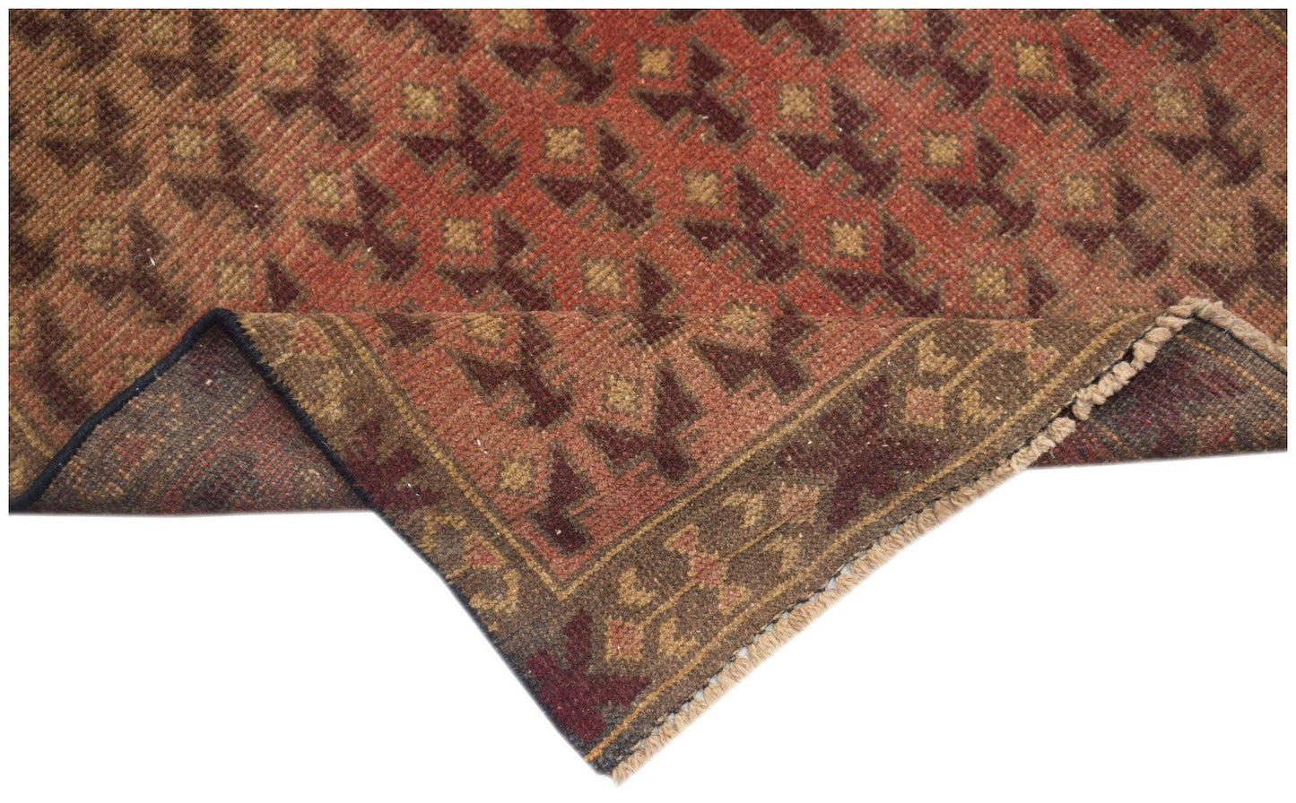 Handmade Afghan Baluch rug featuring a geometric pattern in shades of red and brown.