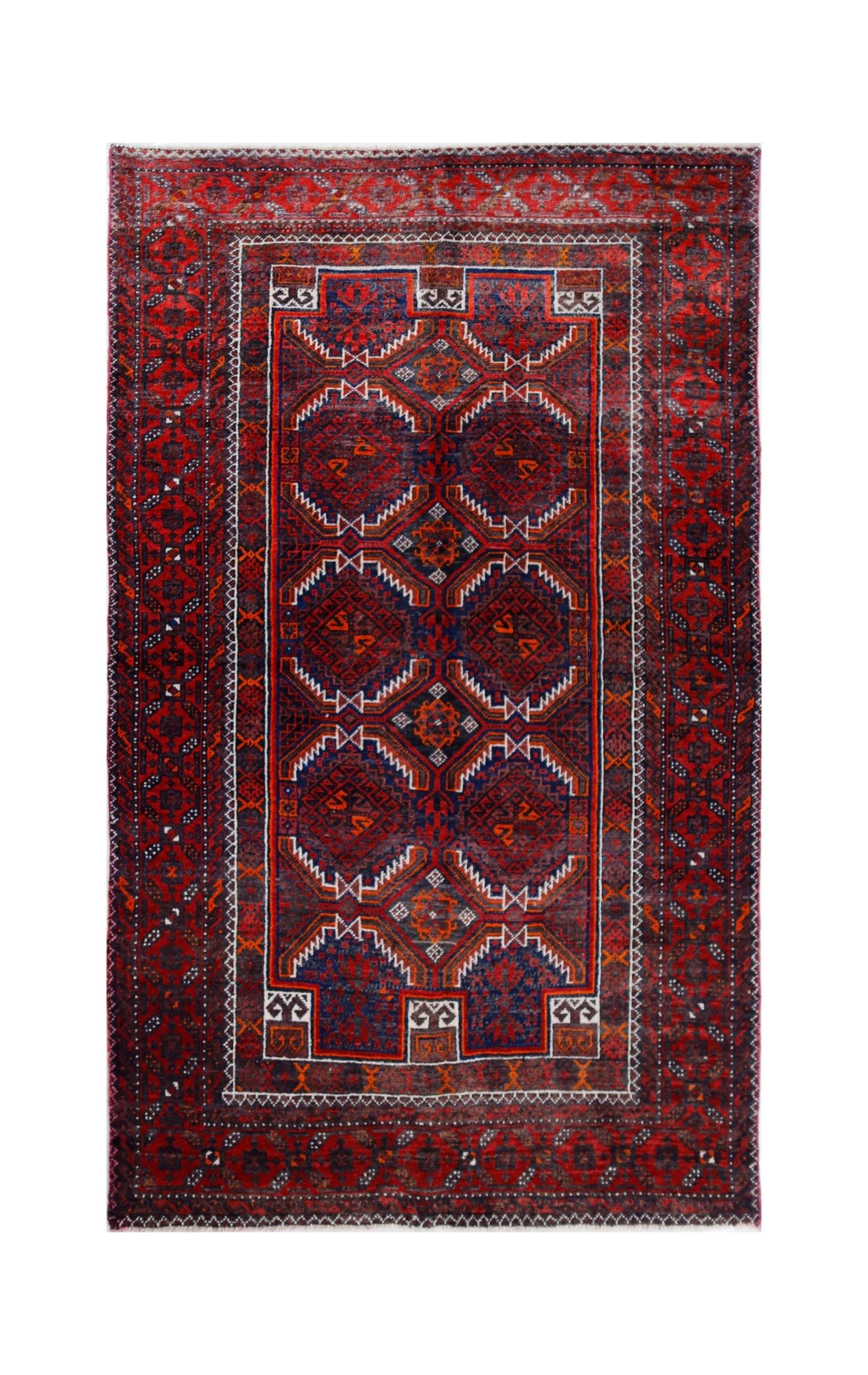 A handmade vintage Afghan Baluch rug featuring geometric patterns in deep red and blue tones.