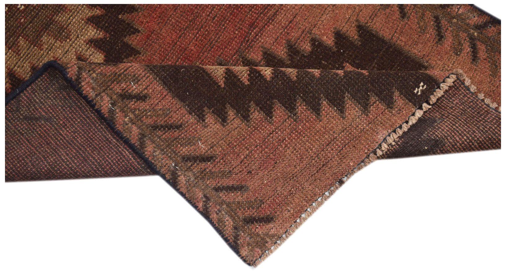 A handmade Afghan Baluch rug featuring a geometric pattern in shades of brown and red.