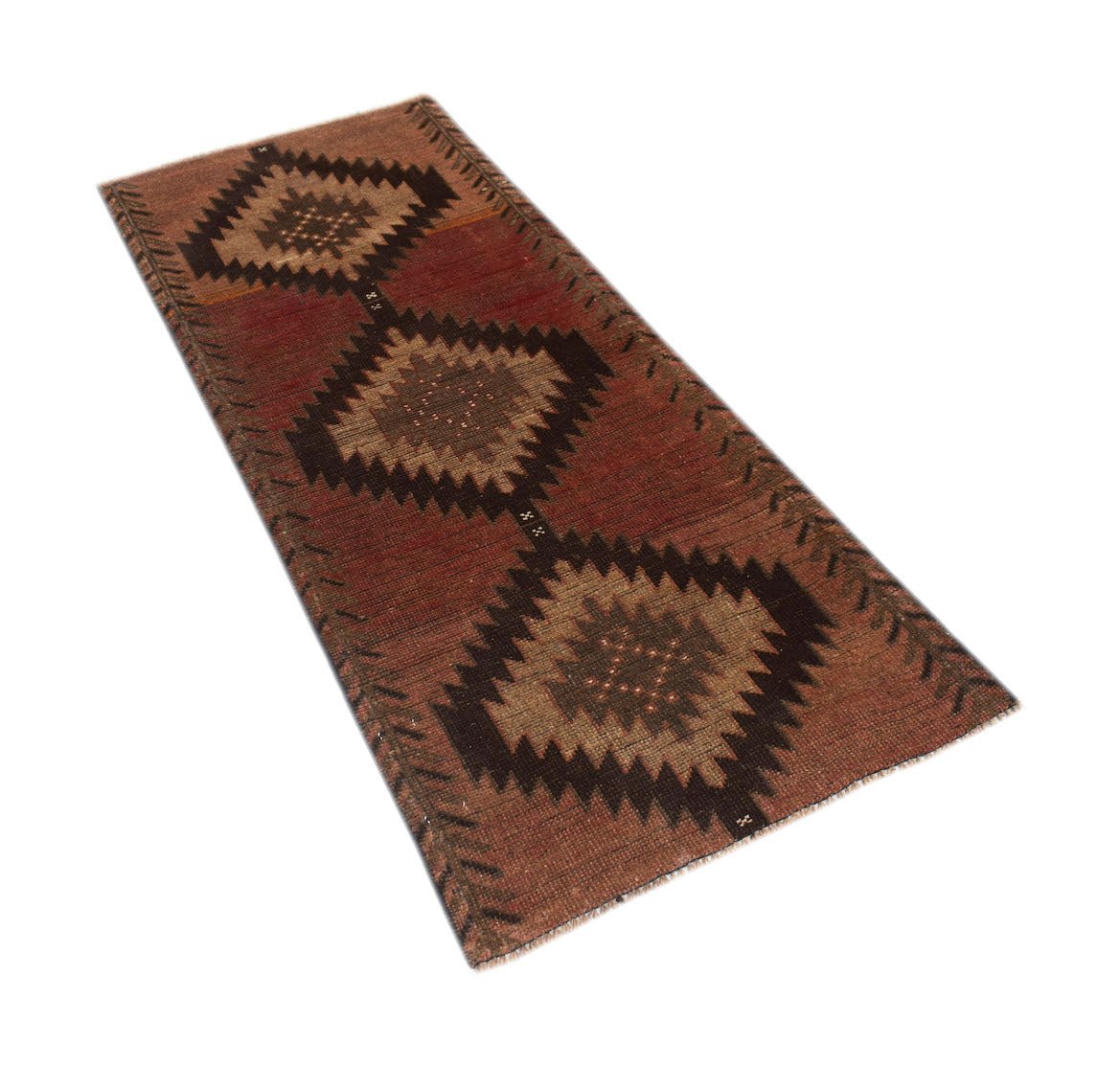 A handmade Afghan Baluch runner rug featuring three dark brown diamond medallions on a red field.