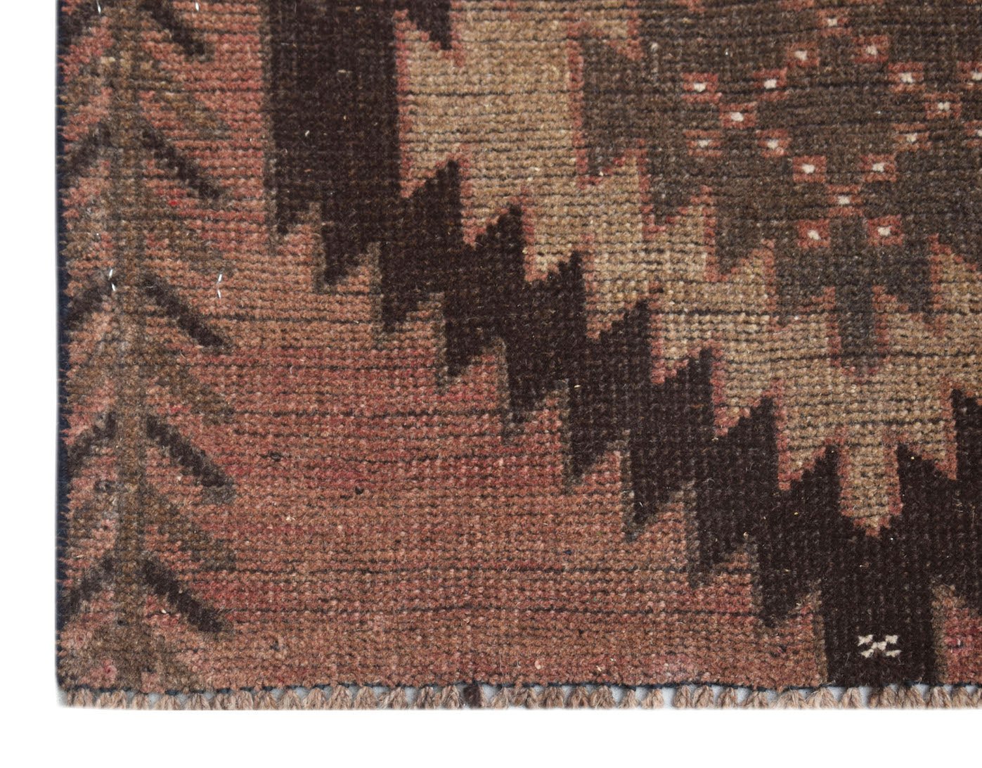 A handmade Afghan Baluch rug featuring a geometric pattern in shades of brown and rust.