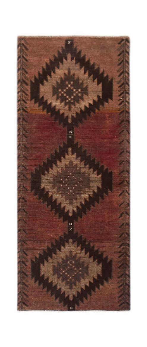 Handmade Afghan Baluch runner rug featuring three dark geometric diamond motifs on a red field.
