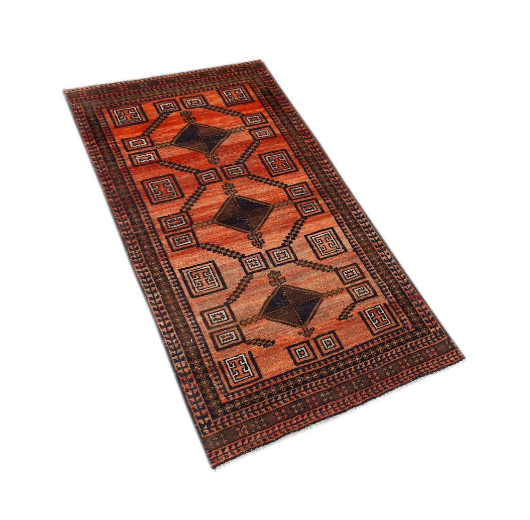 Handmade Afghan Baluch rug featuring a geometric pattern with diamond motifs on an orange field.