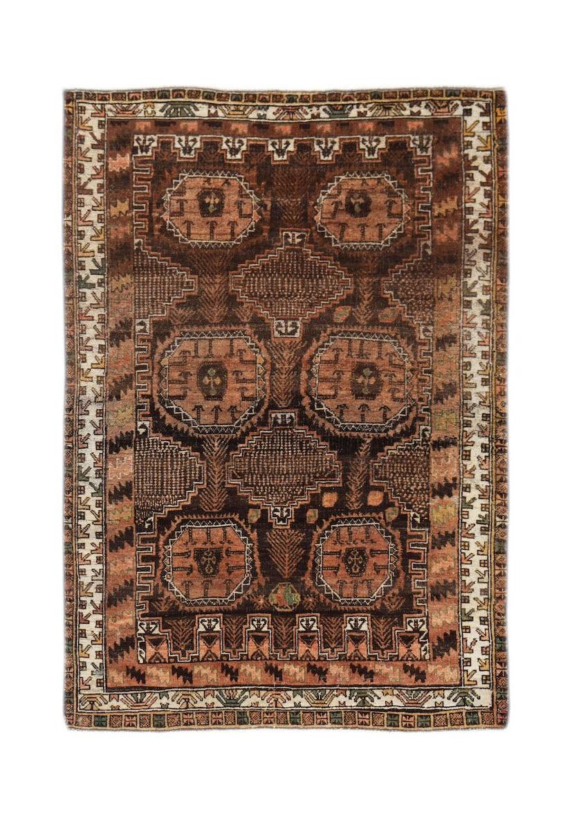 Handmade Afghan Baluch rug featuring a geometric pattern in shades of brown and terracotta.