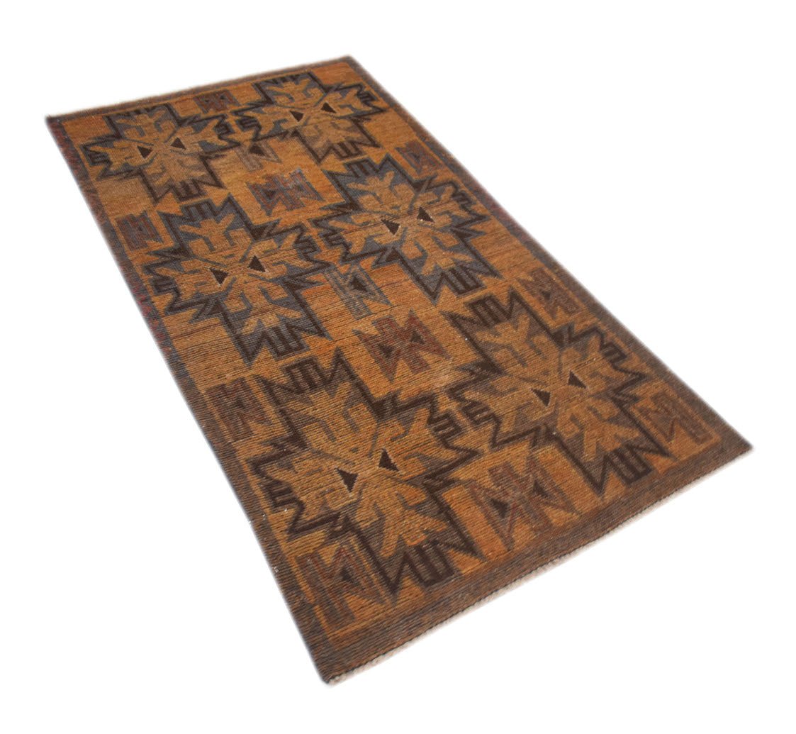 A rectangular handmade Afghan Baluch rug featuring a geometric pattern in shades of brown.