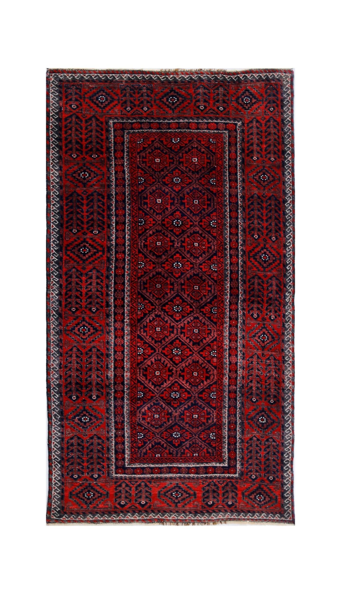 A vintage handmade Afghan Baluch rug featuring a geometric pattern in deep red and navy blue tones.
