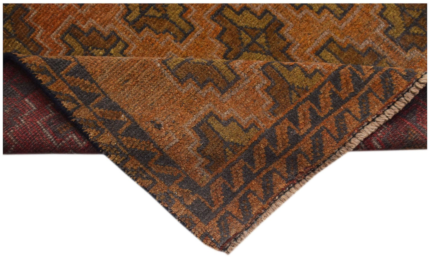 A handmade Afghan Baluch rug featuring a geometric pattern in shades of orange, brown, and olive.