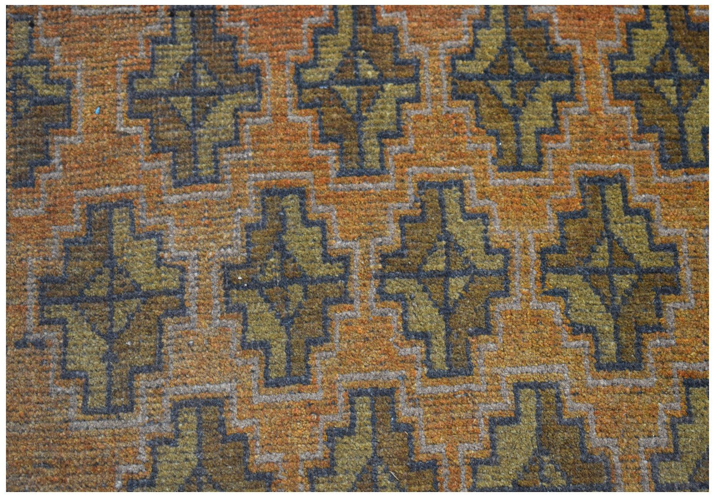 Handmade Afghan Baluch rug featuring a repeating geometric diamond pattern in orange and olive tones.