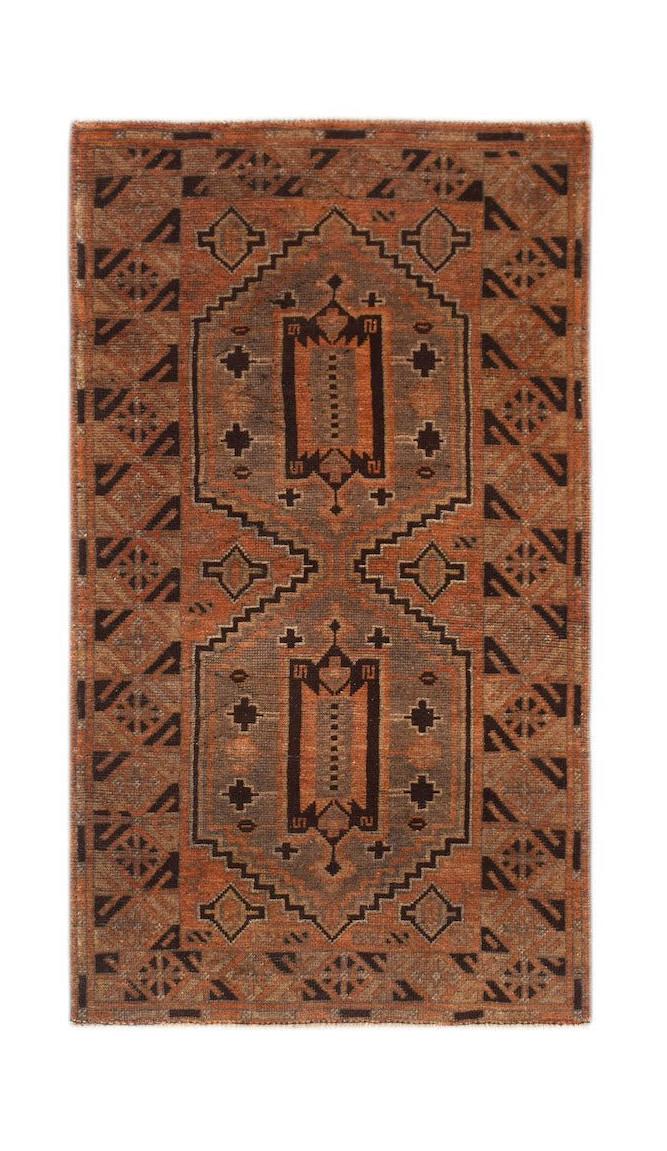 Handmade Afghan Baluch wool rug featuring a geometric pattern in shades of rust and dark brown.