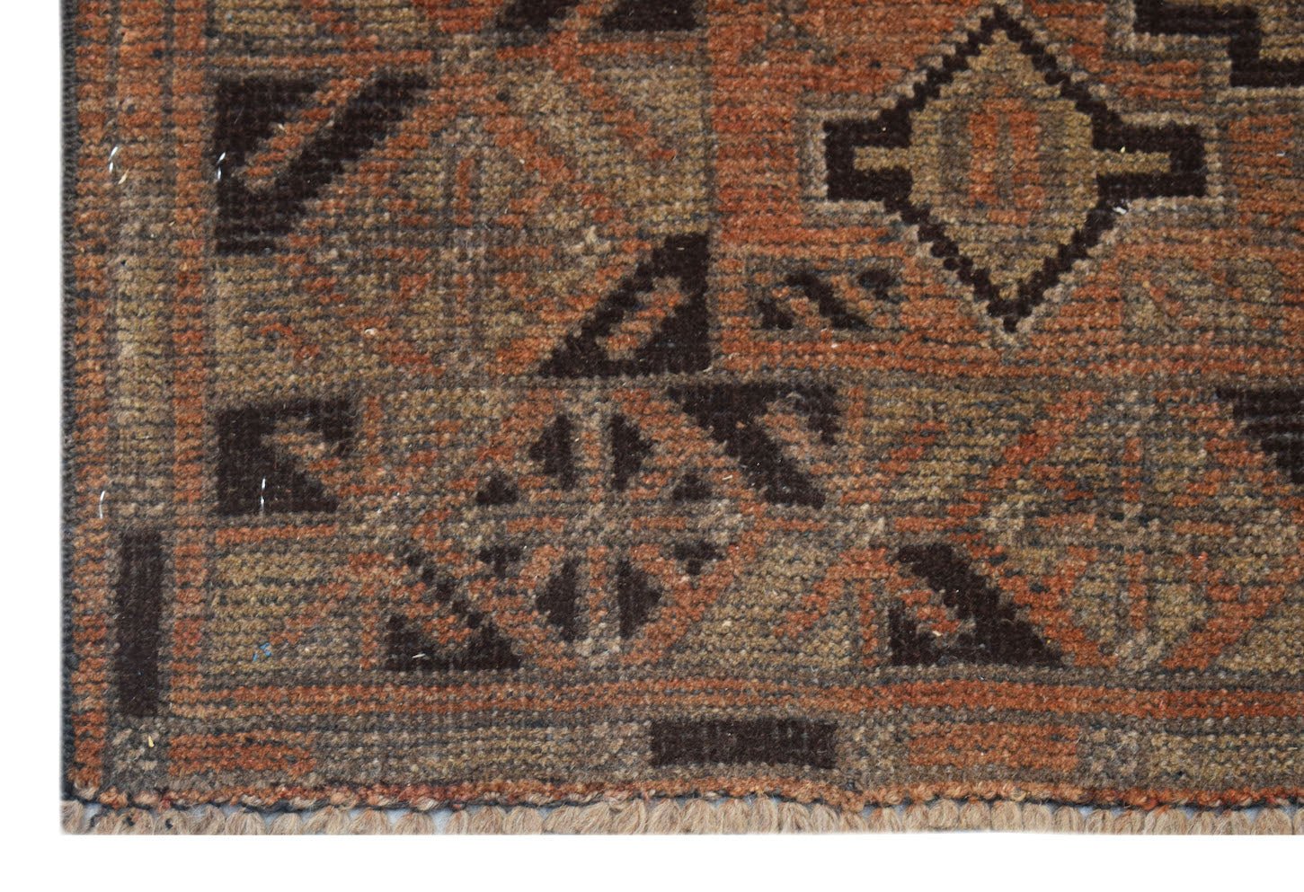 Handmade Afghan Baluch rug featuring a geometric pattern in shades of brown and rust orange.