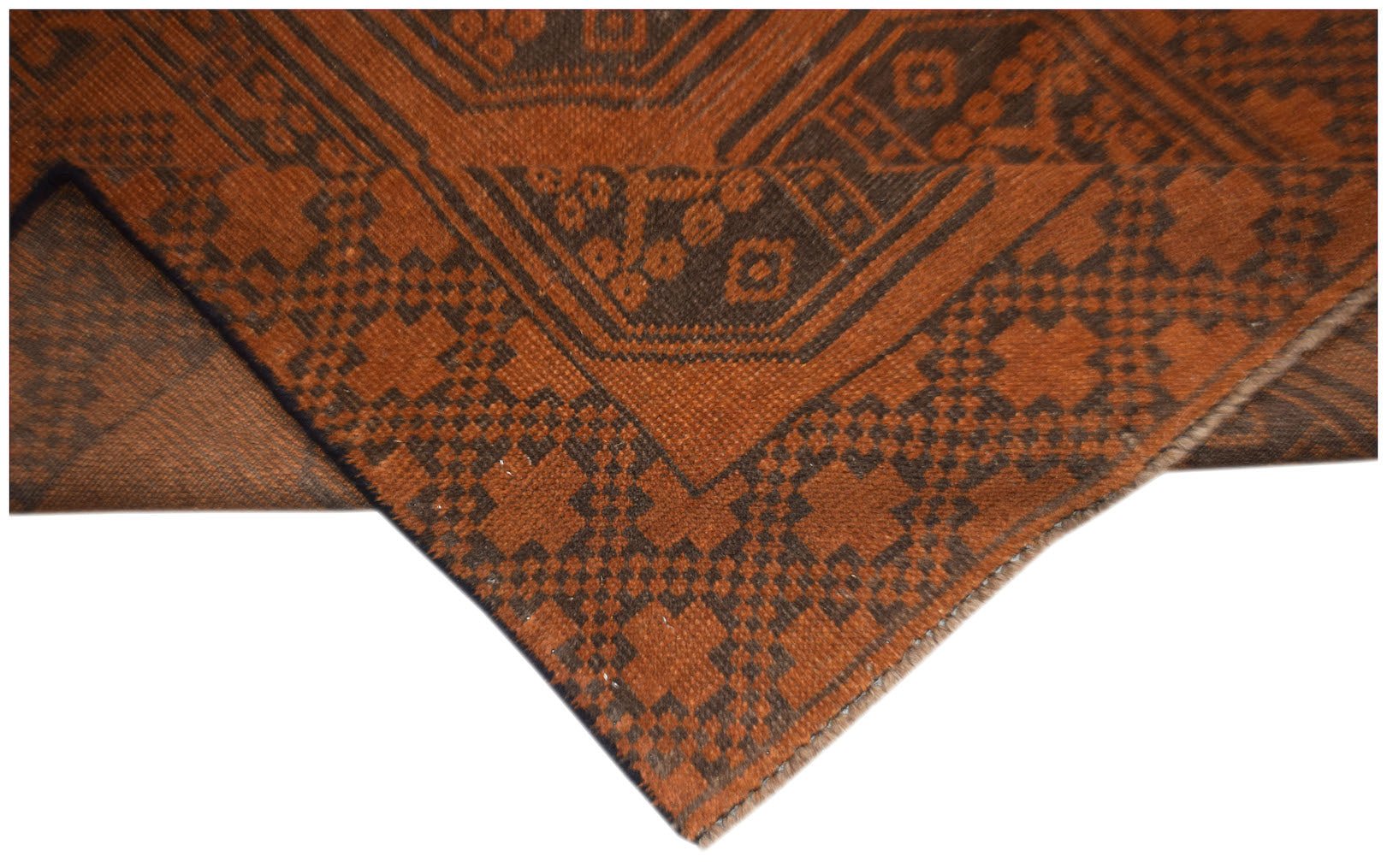 A handmade Afghan Baluch rug featuring a geometric pattern in shades of brown and rust orange.
