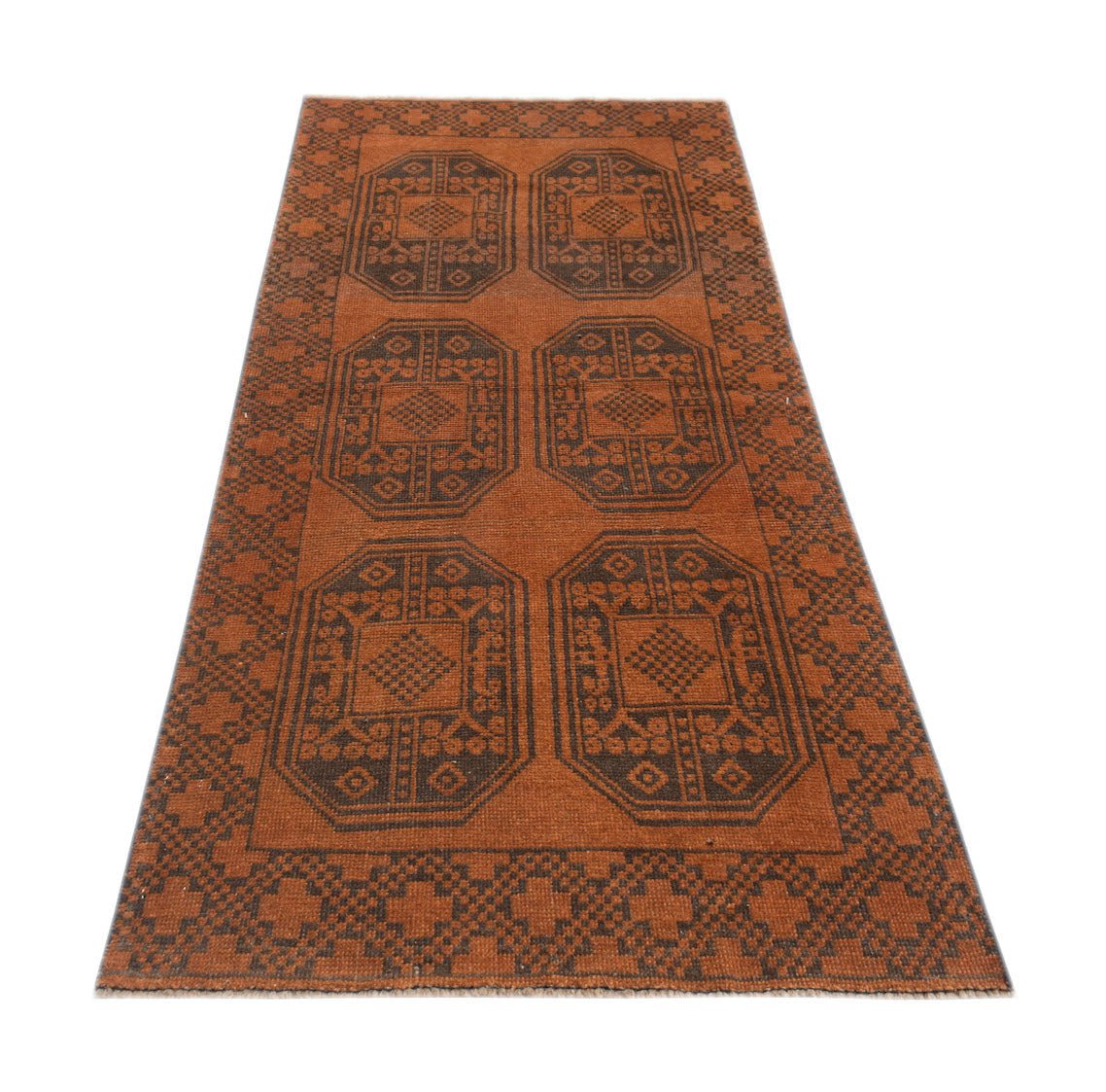 A handmade Afghan Baluch rug featuring a geometric pattern of six dark brown octagons on a rust field.