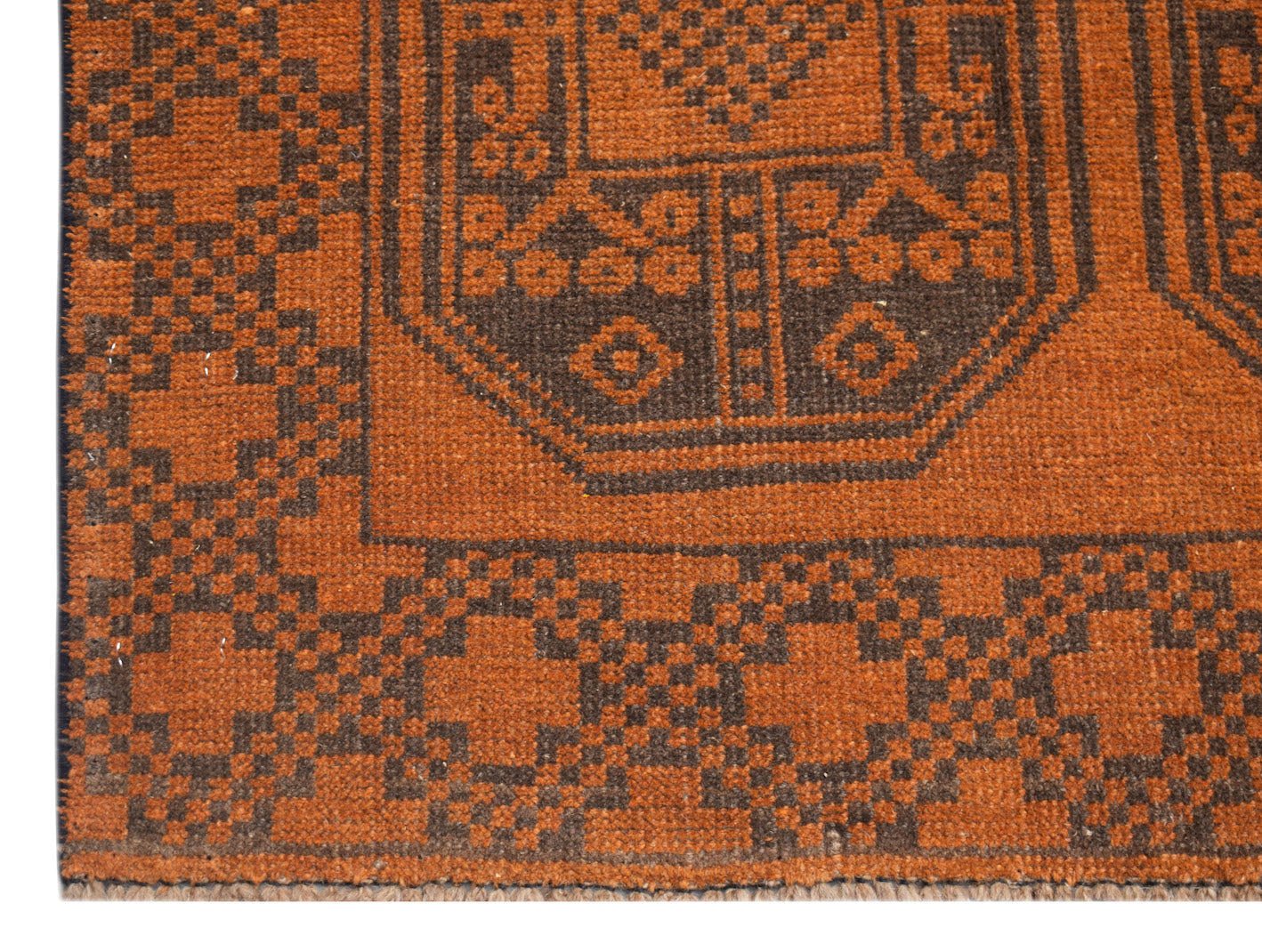 Handmade Afghan Baluch rug featuring a geometric pattern in shades of rust orange and dark brown.
