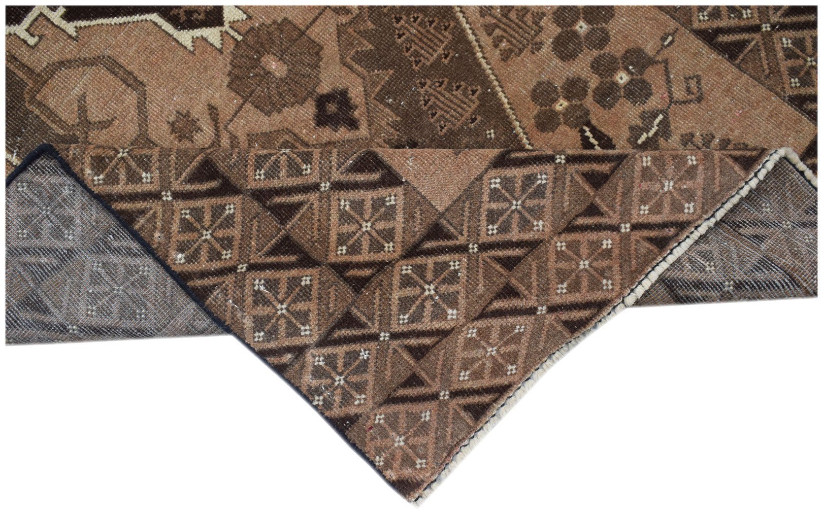 A handmade Afghan Baluch rug featuring geometric patterns in shades of brown and tan.