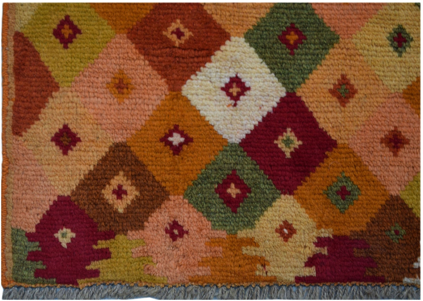Handmade Afghan Baluch rug featuring a colorful diamond pattern with small central motifs.