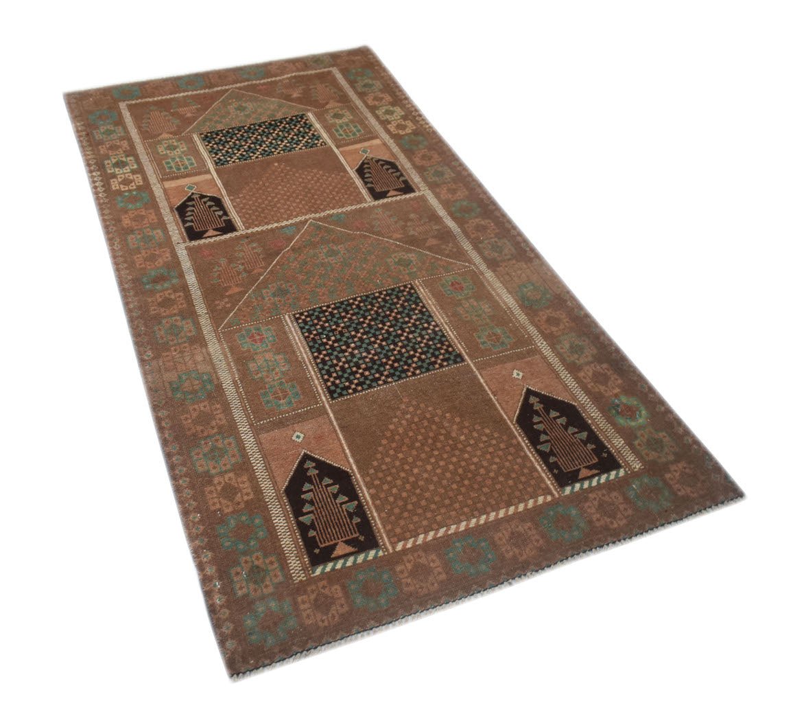 A handmade Afghan Baluch rug featuring a brown field with geometric prayer niche motifs.