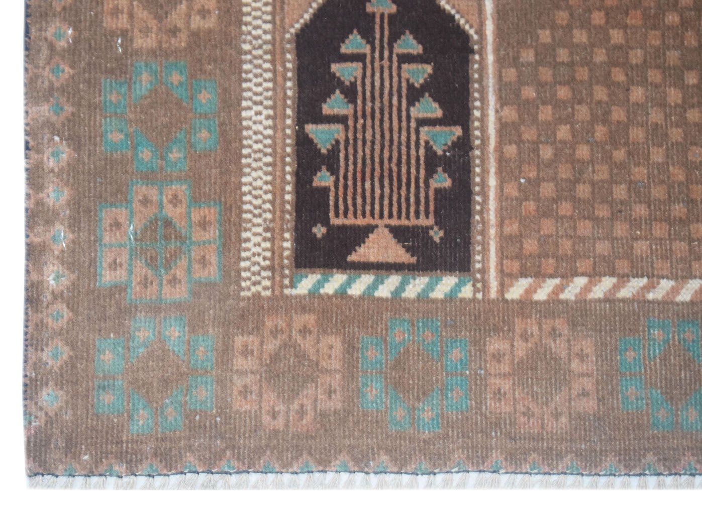 Handmade Afghan Baluch rug featuring a brown field with geometric motifs and a central tree design.