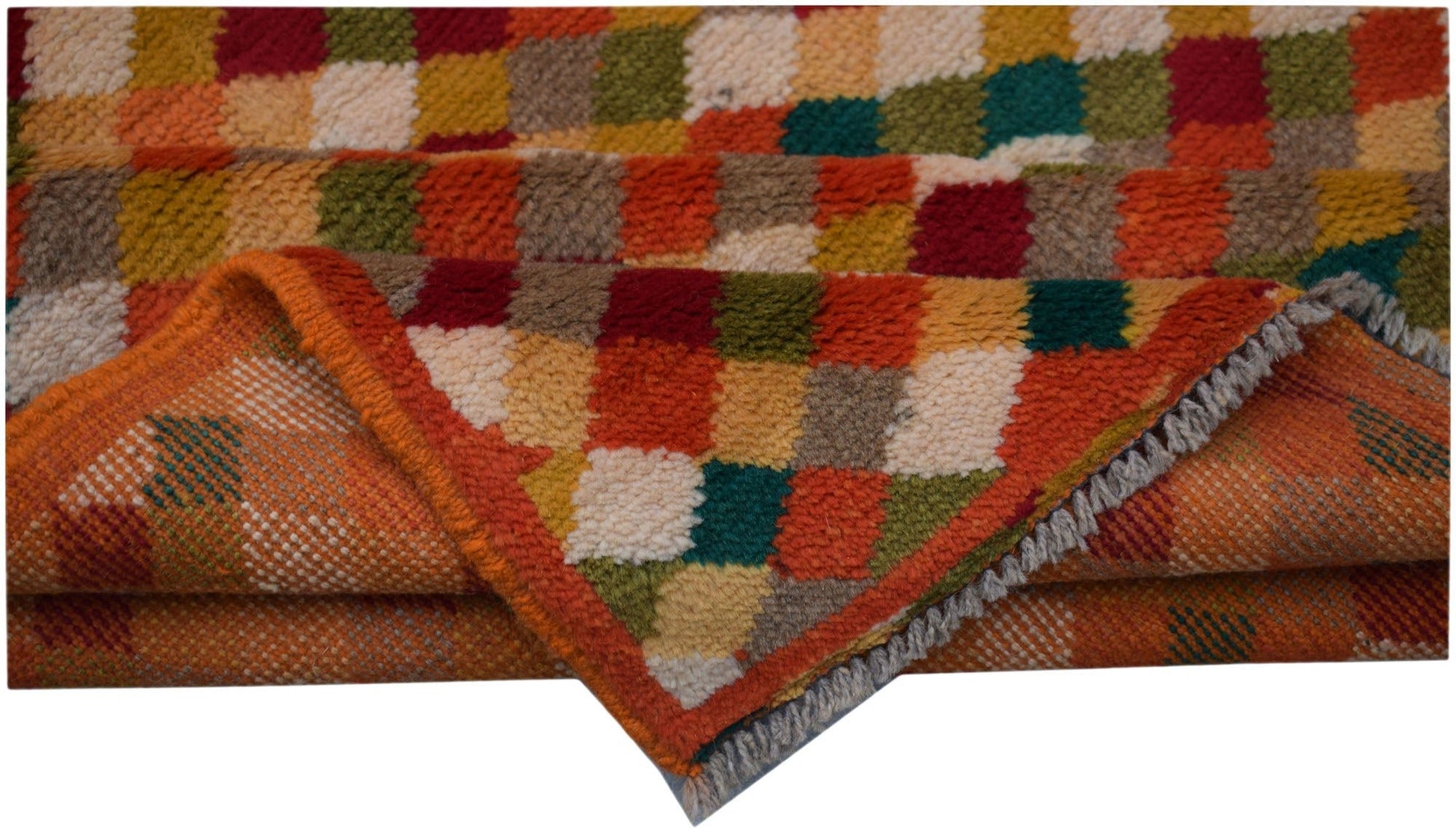 A handmade Afghan Baluch rug featuring a colorful checkered pattern in wool.