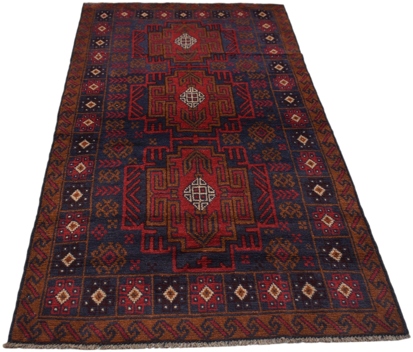 Handmade Afghan Baluch rug featuring geometric patterns in dark red, brown, and blue tones.