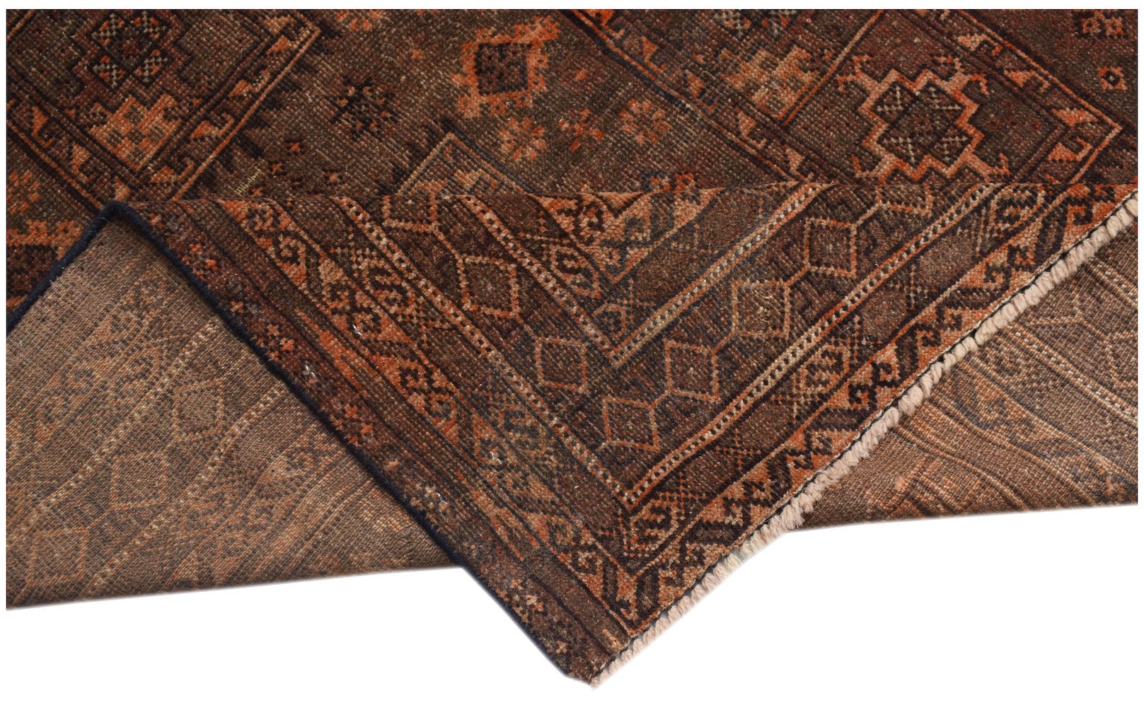 A handmade Afghan Baluch rug featuring geometric patterns in shades of brown and orange.